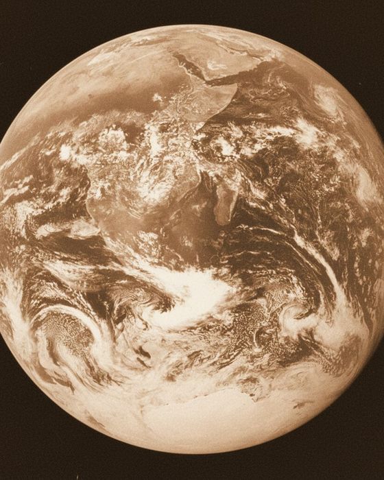 Warm vintage polaroid of The Blue Marble, Earth from Apollo 17 (NASA, 1972) — the photo behind the sample song 'A Thin Blue Ribbon'